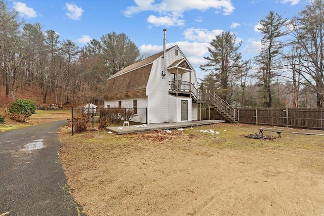 view of side of home featuring a deck