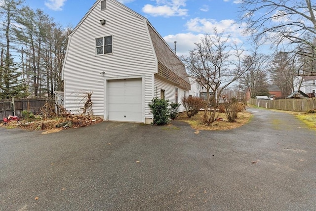 view of property exterior featuring a garage