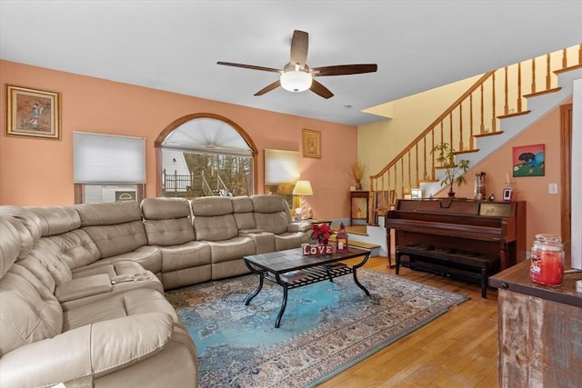 living room with ceiling fan and hardwood / wood-style floors