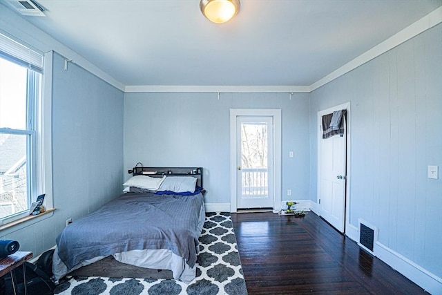 38 Highland Park Ave, Boston, MA 02119 - bedroom featuring crown molding, wood finished floors, and visible vents