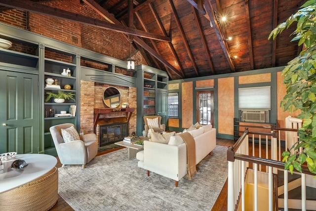 living room with wooden ceiling, beamed ceiling, hardwood / wood-style floors, cooling unit, and a fireplace