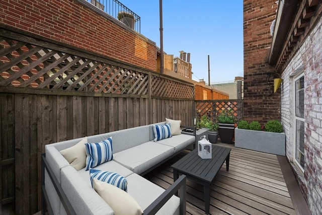 wooden terrace featuring an outdoor living space