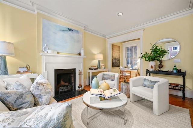 sitting room with parquet flooring and crown molding