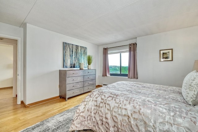 49 Melrose St Unit 7F, Melrose, MA 02176 - bedroom with light wood-type flooring and a textured ceiling