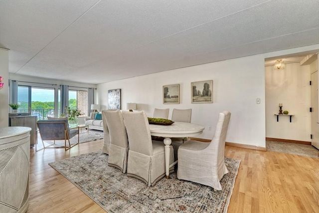 49 Melrose St Unit 7F, Melrose, MA 02176 - dining space featuring light wood-style floors and baseboards