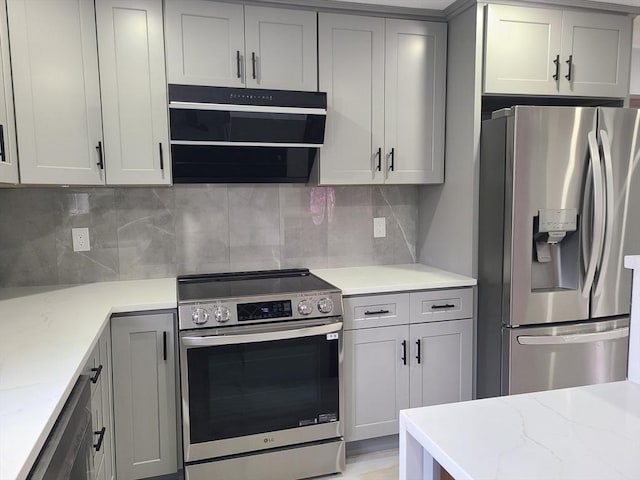 54 Federal St, Weymouth, MA 02188 - kitchen with appliances with stainless steel finishes, gray cabinets, light stone countertops, decorative backsplash, and ventilation hood