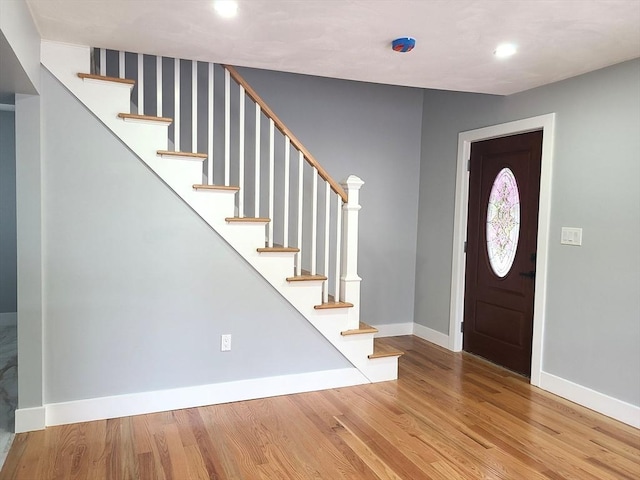 54 Federal St, Weymouth, MA 02188 - entryway featuring baseboards, stairway, wood finished floors, and recessed lighting