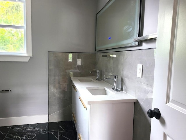 54 Federal St, Weymouth, MA 02188 - kitchen featuring a sink, tile walls, light countertops, and marble finish flooring