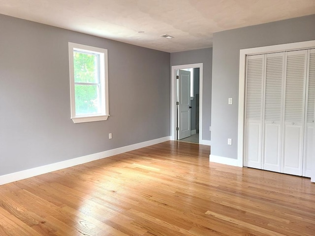 54 Federal St, Weymouth, MA 02188 - unfurnished bedroom with light wood-type flooring, baseboards, and a closet