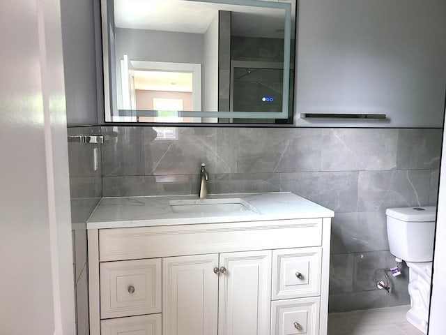 54 Federal St, Weymouth, MA 02188 - bathroom with vanity, toilet, and backsplash