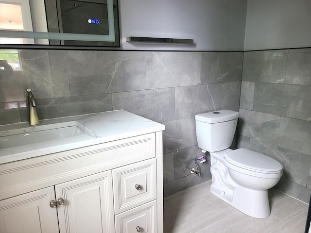 54 Federal St, Weymouth, MA 02188 - half bath featuring tile walls, toilet, vanity, and tile patterned floors