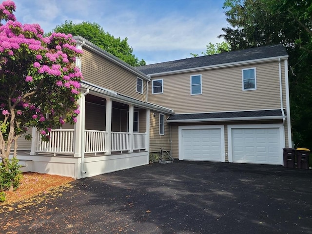 54 Federal St, Weymouth, MA 02188 - view of front of house with covered porch, driveway, and a garage