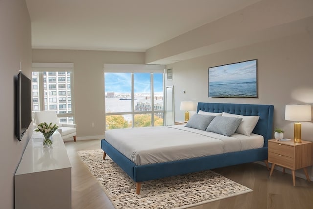 bedroom with hardwood / wood-style floors