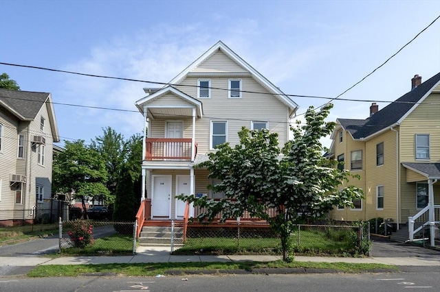 108-110 New Bridge St, West Springfield, MA 01089 - view of front of property featuring a balcony, a fenced front yard, and a porch
