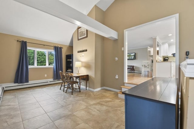 kitchen with baseboard heating and lofted ceiling