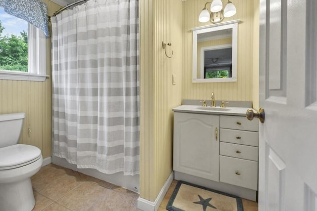 full bathroom with toilet, tile patterned flooring, vanity, and shower / bathtub combination with curtain