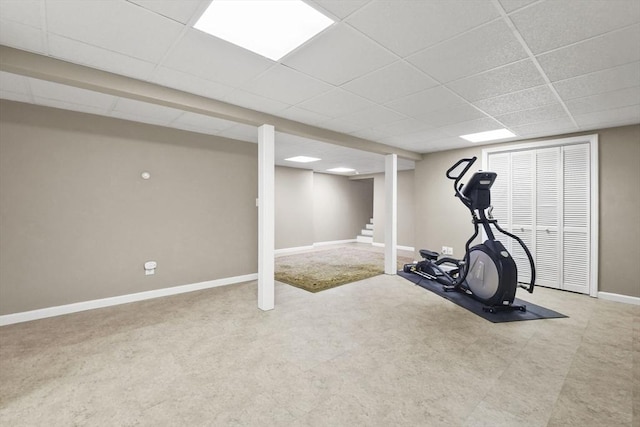 exercise room with a paneled ceiling