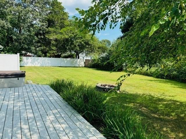 view of yard featuring a wooden deck