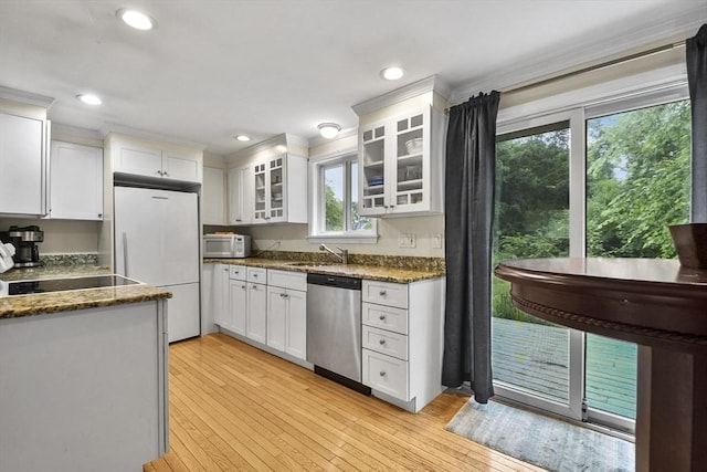 kitchen featuring white refrigerator, white cabinets, light wood-type flooring, and dishwasher