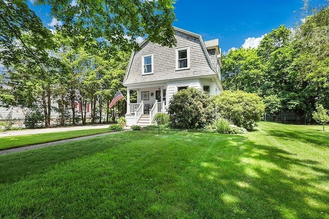 40 Maple St, Mansfield, MA 02048 - dutch colonial with a gambrel roof and a front lawn