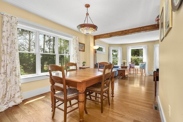 40 Maple St, Mansfield, MA 02048 - dining space featuring light wood-style floors and beamed ceiling