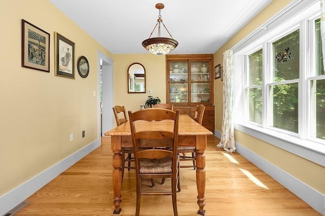 40 Maple St, Mansfield, MA 02048 - dining space featuring light wood-type flooring and baseboards