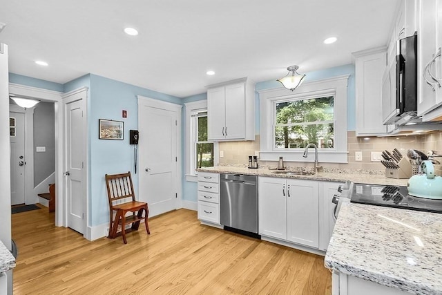 40 Maple St, Mansfield, MA 02048 - kitchen featuring stainless steel appliances, light wood finished floors, tasteful backsplash, white cabinets, and recessed lighting