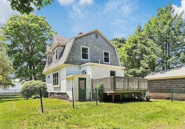 40 Maple St, Mansfield, MA 02048 - rear view of property featuring a wooden deck, a gambrel roof, and a chimney