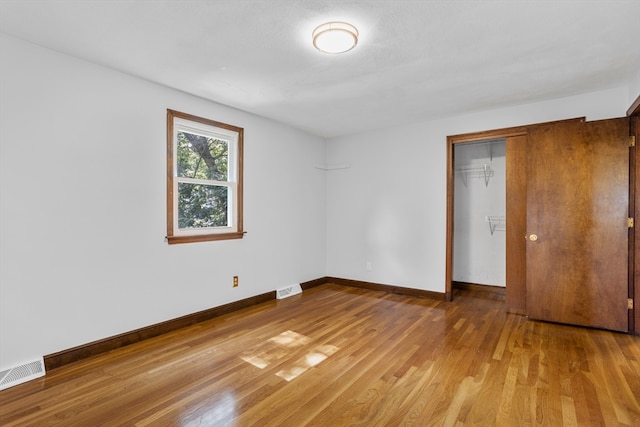 unfurnished room featuring wood-type flooring