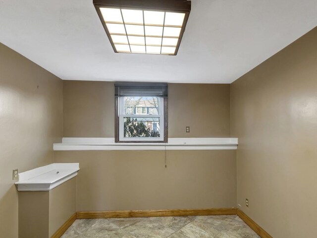 tiled spare room with wooden walls