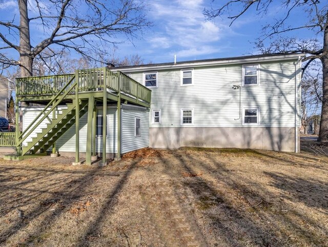 view of yard featuring a wooden deck and a storage shed