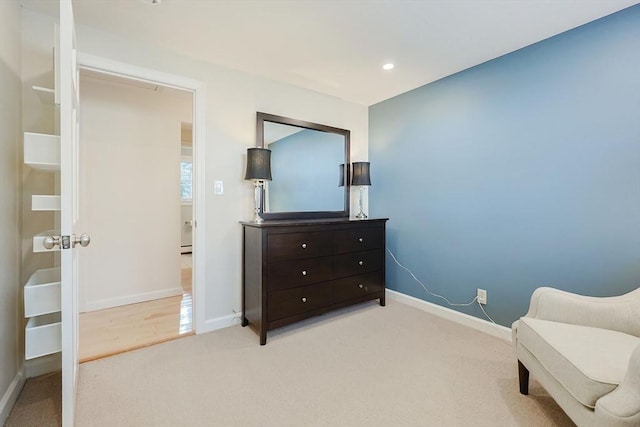 sitting room with light colored carpet