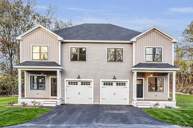 modern inspired farmhouse featuring driveway, a front yard, roof with shingles, and an attached garage