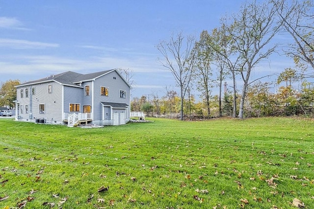 view of home's exterior featuring a lawn and a garage