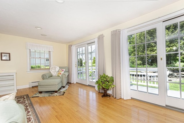 12 Crosby, Webster, MA 01570 - living area featuring light wood finished floors, baseboards, baseboard heating, and recessed lighting