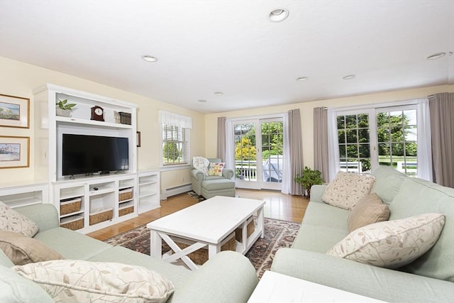 12 Crosby, Webster, MA 01570 - living area with baseboard heating, wood finished floors, and recessed lighting
