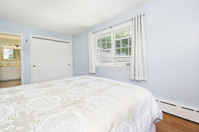 12 Crosby, Webster, MA 01570 - bedroom with a baseboard radiator, wood finished floors, a closet, and connected bathroom