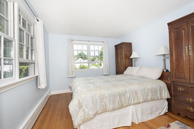 12 Crosby, Webster, MA 01570 - bedroom with wood finished floors, baseboards, and a baseboard radiator