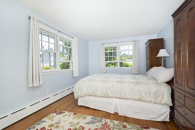 12 Crosby, Webster, MA 01570 - bedroom with a baseboard heating unit and wood finished floors