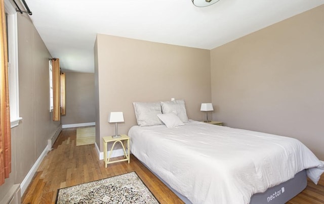 12 Crosby, Webster, MA 01570 - bedroom with wood finished floors, baseboards, and a baseboard radiator