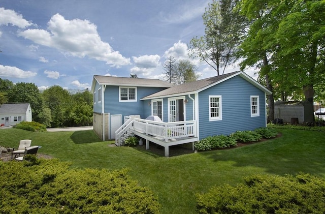 12 Crosby, Webster, MA 01570 - back of property featuring a wooden deck and a yard