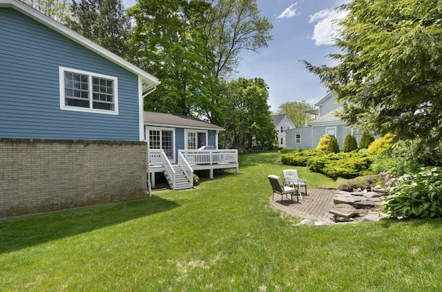 12 Crosby, Webster, MA 01570 - view of green lawn with a deck and a patio
