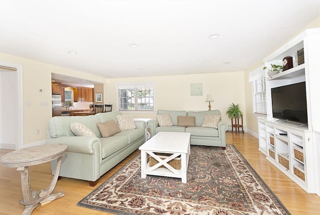 12 Crosby, Webster, MA 01570 - living area featuring light wood finished floors and baseboards