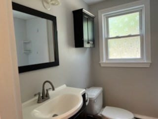 bathroom featuring sink and toilet