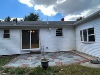 back of house with a patio