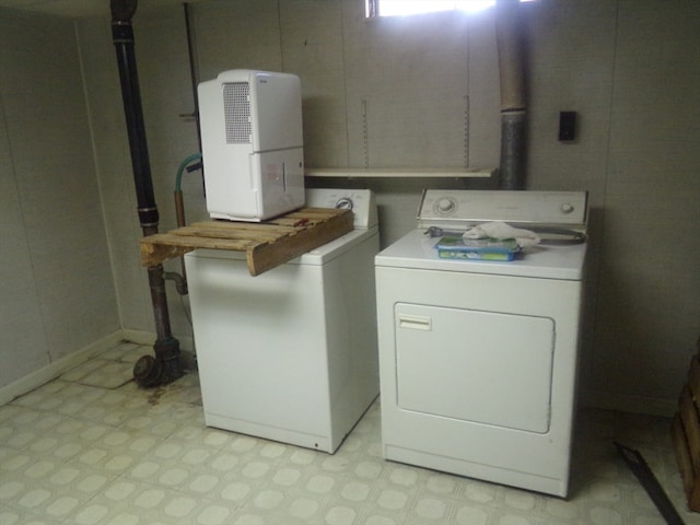 washroom with separate washer and dryer