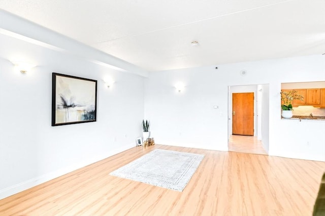 200 Cove Way Unit 106, Quincy, MA 02169 - empty room with light wood-style floors and a smoke detector