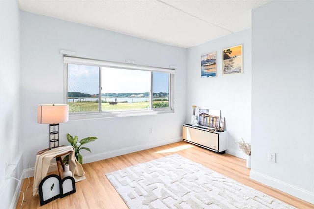 200 Cove Way Unit 106, Quincy, MA 02169 - sitting room featuring wood finished floors and baseboards