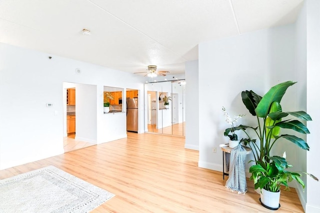 200 Cove Way Unit 106, Quincy, MA 02169 - living room with light wood-type flooring and ceiling fan