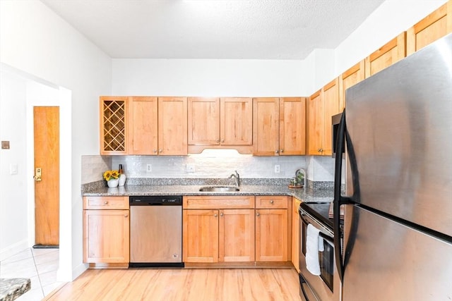 200 Cove Way Unit 106, Quincy, MA 02169 - kitchen with freestanding refrigerator, dishwasher, electric range oven, decorative backsplash, and dark stone countertops